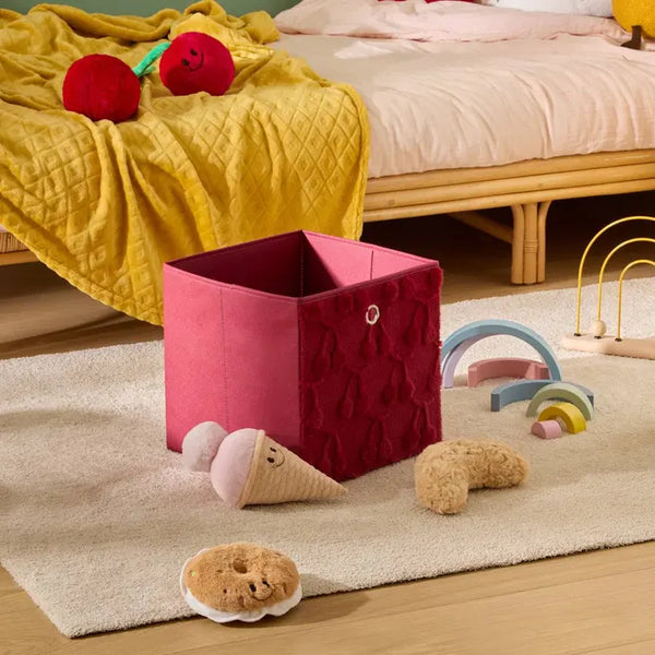 Pink storage box with pompoms