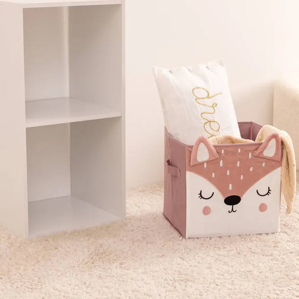 Pink storage box with pompoms